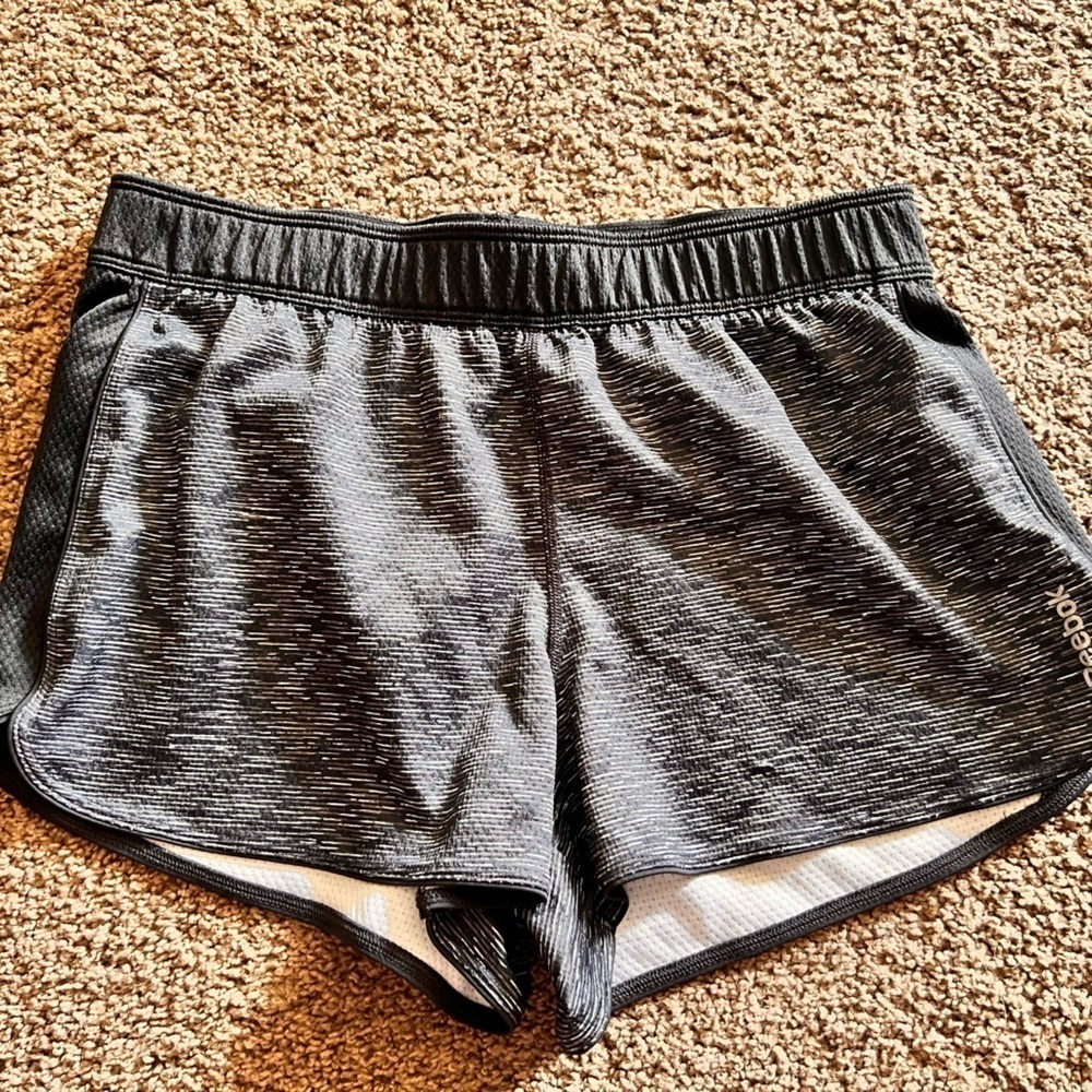 Woman’s Reebok black and white running shorts.